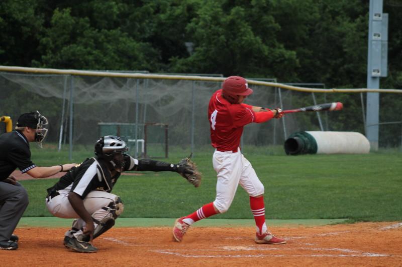 Jarrett Harness (12, #4)  hits the double that would end the game, bringing in Trae Gordon (12, #8) for the mercy-rule run. Photo by Shea Dobson.