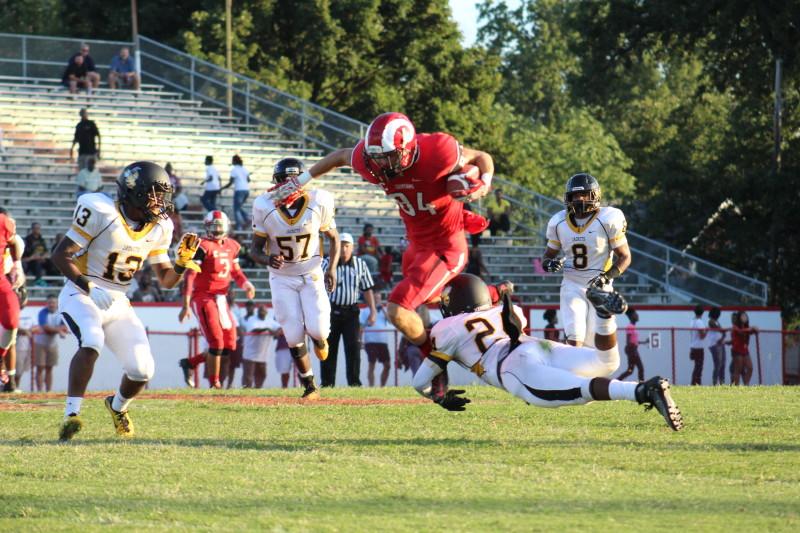 Eric Niemann (12, #84) gets Manual to Central's 39 yard line with a pass from Tim Comstock (12, #3). Photo by Kate Hatter 