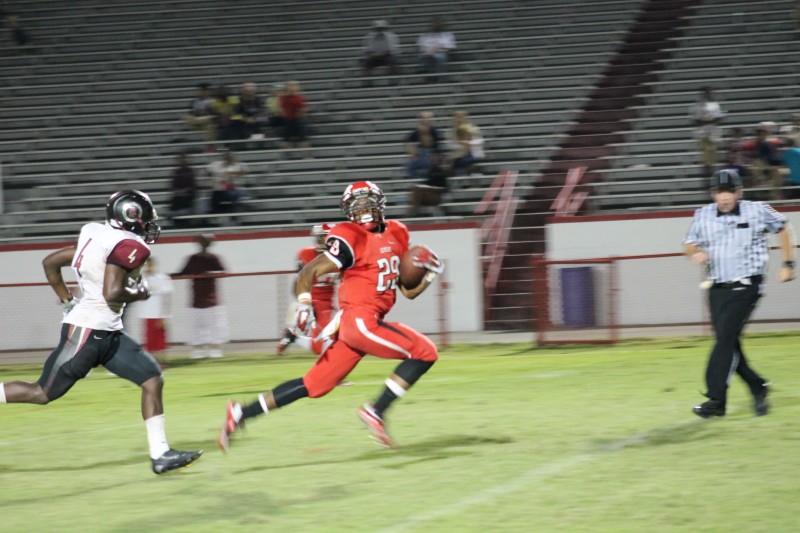 Troy Henderson (10, #29) runs for a 34 yard touchdown to give Manual a 24-19 lead with 2:36 left in the game.
