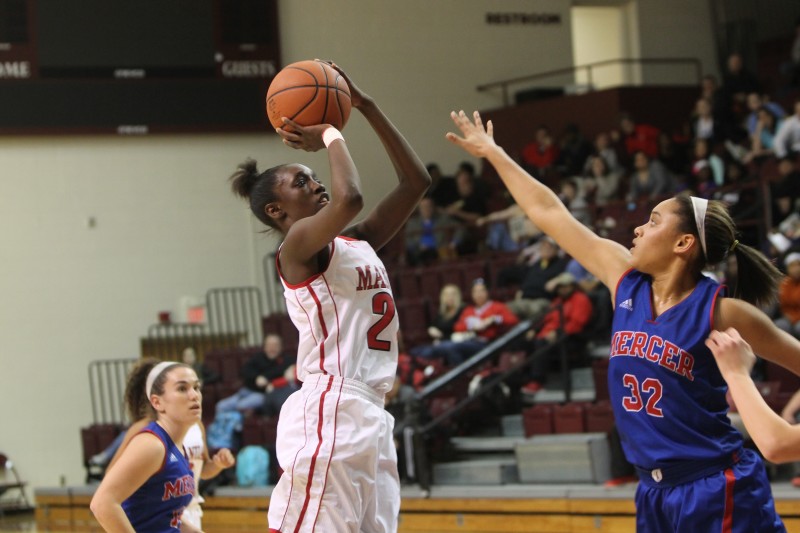 Aniah Griffin (10, #21) rises up from three to send the game to overtime. Photo by Jordyn Stumpf.