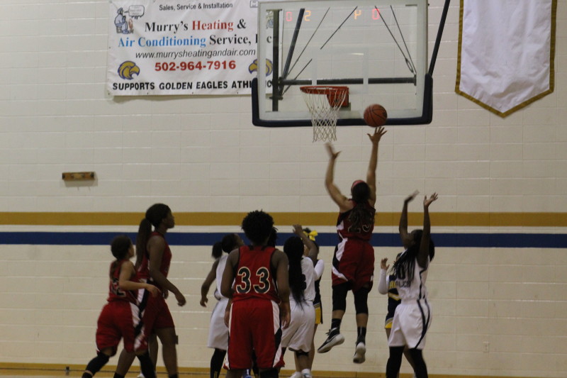 Tonysha Curry (12, #23) goes up for a lay up in the second quarter. Photo by Kate Hatter