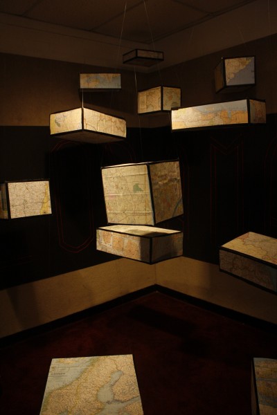 Boxes with maps of the world hung from the ceiling in the spirit of the theme which was "Explorama."