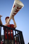 Patrick Frentz (12)  uses the megaphone to get the crowd and student section energized. 