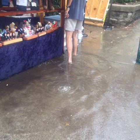 Shallow water flooded the St. James Art Fair on Saturday. Photo by Catherine Runner.