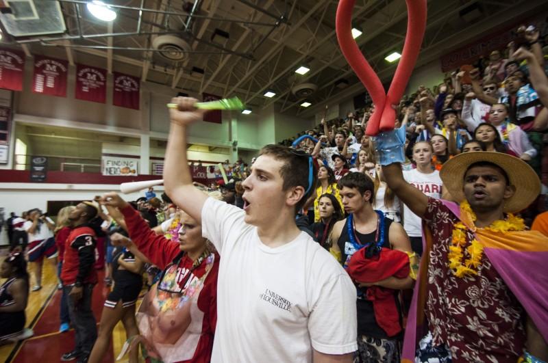 Jesse Smith(12) stands alongside his friends as he cheers with them. Photo by Jack Steele Mattingly