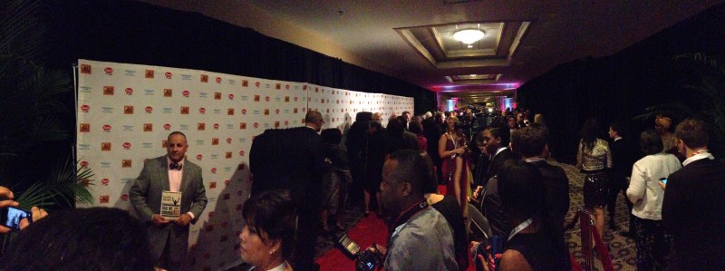 Guests and journalists wait on the red carpet before the main program