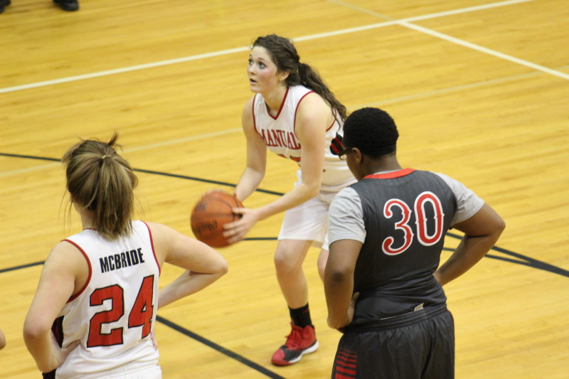 Sydney MacBlane (11, #22) shoots a free-throw to give the Lady Crimsons' a 26 point lead in the third quarter. 