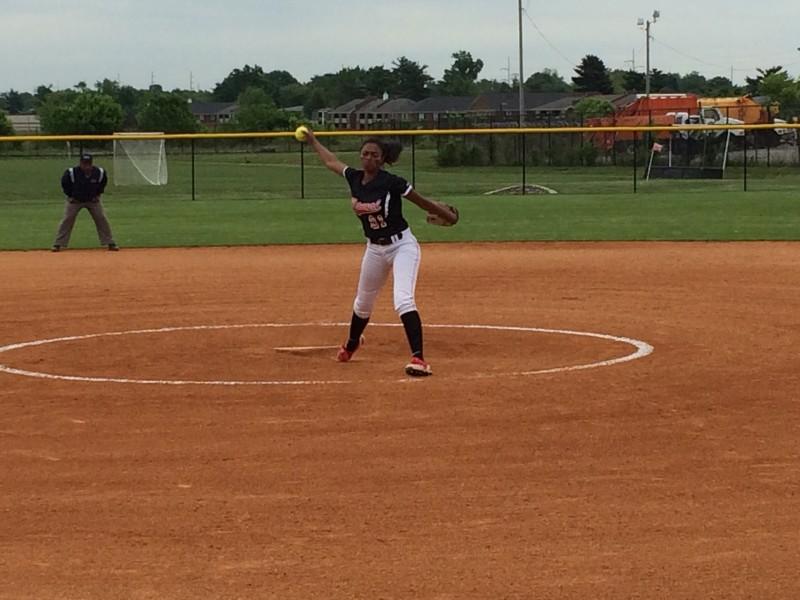 Pitcher Madison Williams (11, #21) winding up for a pitch. Photo by RJ Radcliffe