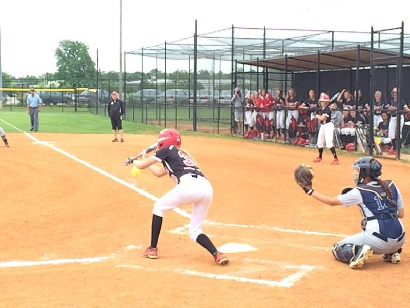 Kelly Riggs (12, #30) attempts a bunt against Presentation. Photo by RJ Radcliffe