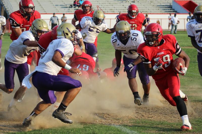 Running back Troy Henderson (10, #29) rushes for a first down. Photo by Kate Hatter 