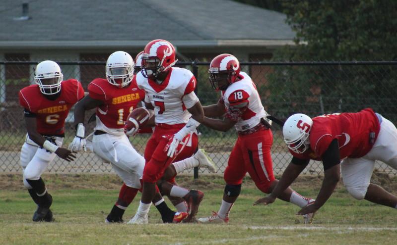 Bryce Cosby (11, #7) intercepts the ball for a 55 yard return for a touchdown. Photo by Kate Hatter