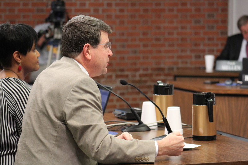 Jefferson County Teachers' Association (JCTA) president Brent McKim presents the 2014-2015 TELL survey results to the board. Photo by Kate Hatter