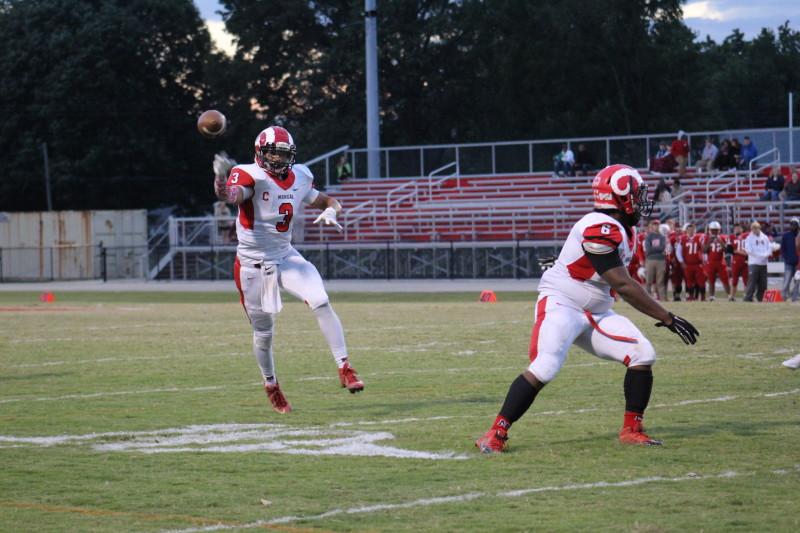 Tim Comstock (12, #3) throws a complete pass to Jalen Carter. Photo by Kate Hatter 