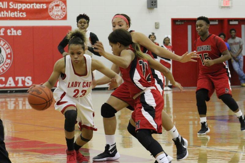 Trapping ball handlers and forcing turnovers were both key to Manual's stifling defense. Photo by Kate Hatter. 