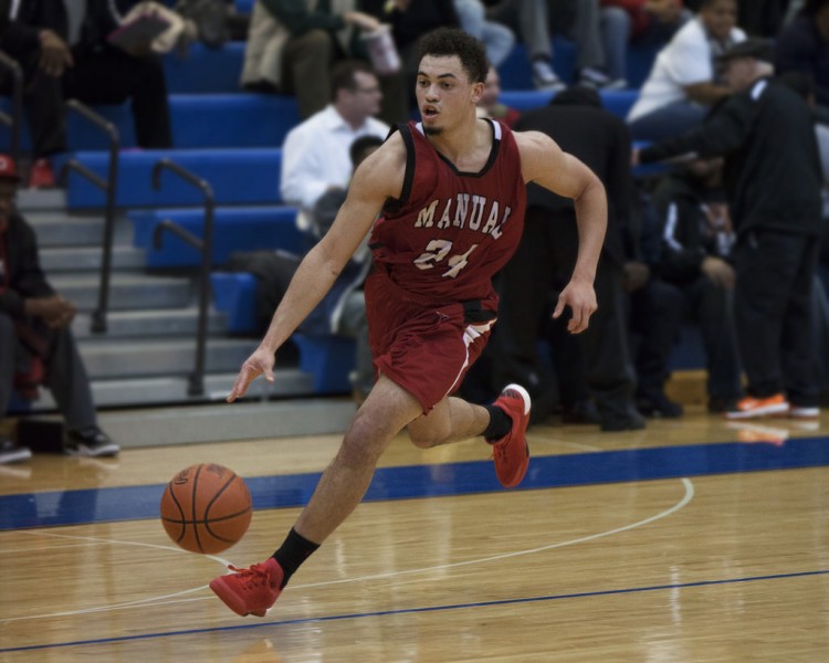 Tim Comstock (12, #24) running in transition. Photo by Piper Cassetto.