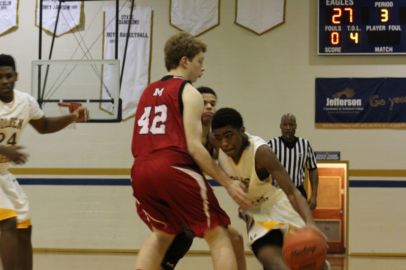 Noah Hawkins (10, #42) defends against the Golden Eagles drive. Photo by Kate Hatter