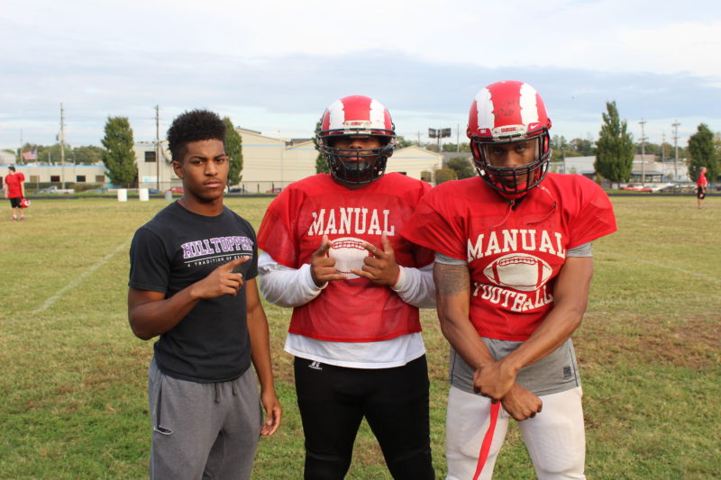After practice Bryce Cosby (7, 12), Sean Cleasant (98, 12) and Jaelin Carter (11, 12) pose for a photo. Photo by Olivia Evans.