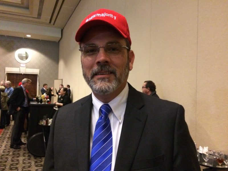State representative Ken Upchurch wears a hat that says "a new majority."